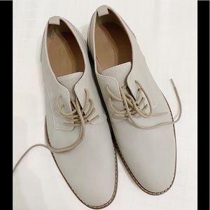 Light gray men’s dress shoes lace up